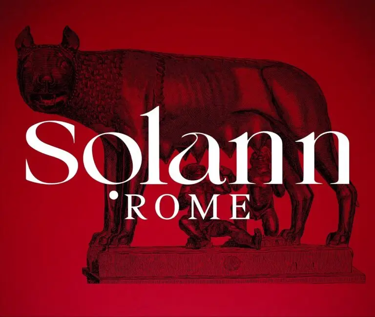 Pochette de la chanson 'Rome' de Solann avec un fond rouge, une illustration de la Louve romaine allaitant Romulus et Rémus, et le titre en typographie blanche élégante.